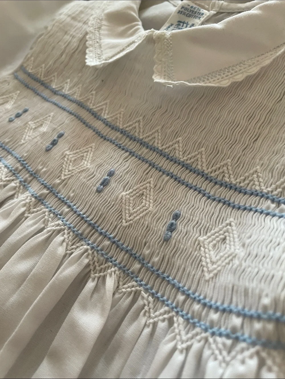 Feltman White Smocked Baby Romper with Blue Embroidery 0-3